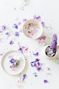 purple and white flowers on white ceramic plate